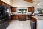The kitchen was recently remodeled and now has all stainless steel appliances and granite countertops. 